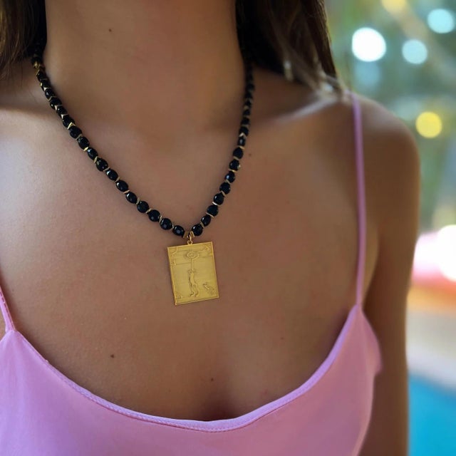 This Healer Spiral Sun Shamanic Pendant Black Onyx Beaded Necklace is a beautiful and meaningful piece of handmade jewelry...