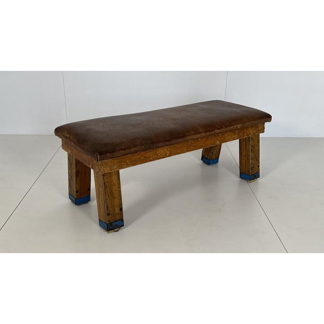 Decorative vintage gymnastic bench from the 1940s and 1950s. The robust cowhide leather and oak wood have a distinctive...