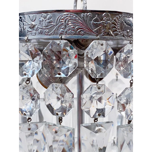 Silver plated basket chandelier with 30% leaded A-chain crystals. Rewired and restores and it has 2 Edison based sockets...