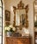 A wonderfully decorative early 20th-century giltwood wall mirror in the French Louis XV tradition, distinguished by an...