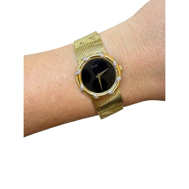 Reference: 9039 B1 Case Dimensions: 25 mm Dial: black Bezel: diamond Movement: Manual Wind Material: 18K yellow gold and...