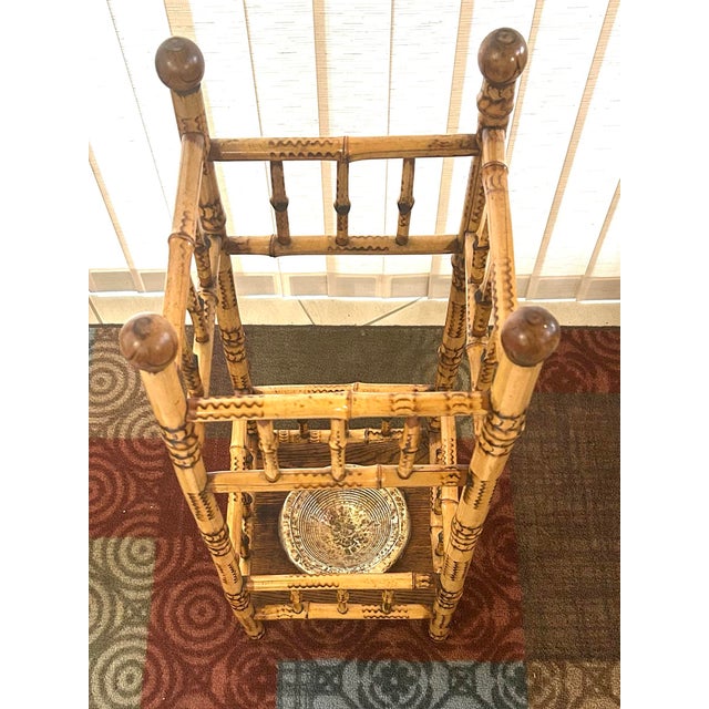 This English Victorian umbrella/cane stand is as colorful as it is practical! It incorporates ball finials, stretchers and...