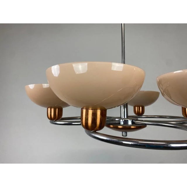 Art deco chandelier with pink glass lampsahdes in very good original condition. Up to 250V (Europe/UK Standard).The wiring...