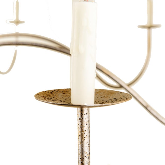 The Moss Creek Chandelier exudes a luxurious feel with its sleek curves and 8 candelabra-style bulbs, each finished with...