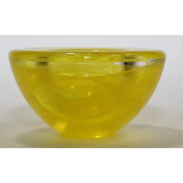 Kosta Boda crystal yellow "Atoll" votive Tealight candle holder designed by Anna Ehrner, 1990s. With characteristic...
