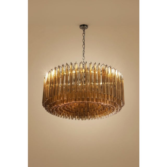 DUTIES FREE An exceptional and monumental Italian Murano glass chandelier featuring 391 handcrafted triedri prisms in an...