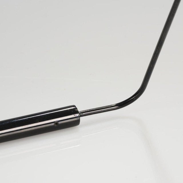 Slalom table light is a work realized by Vico Magistretti in 1981. H. 45 x 24 x 25 cm. Made by Oluce, Milan. Tubular...