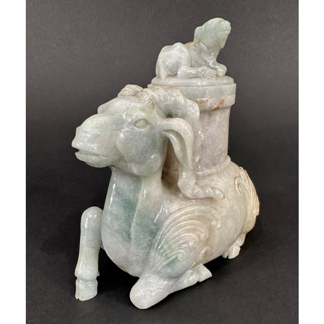 A carved jade censer in the form of a ram, the lid of which features a carved baby sheep, or kid. In China censers are...