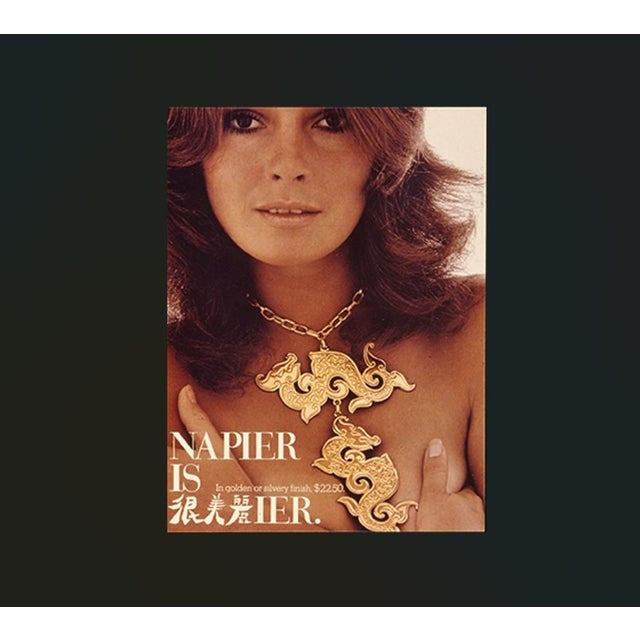 Goldtone Asian style textured dragon or sea serpent large pendant on a chain necklace with spring ring clasp. Marked...