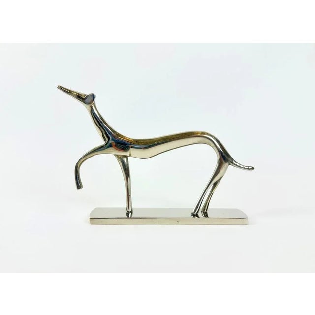 This Art Deco sculpture, depicting a stylized greyhound, is an original work from around 1930, in the Hagenauer style,...