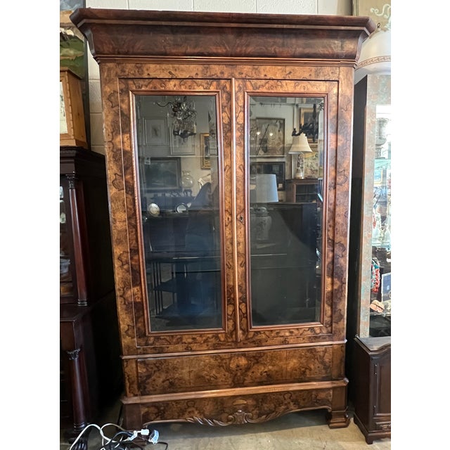 Large 19th-century French Louis Philippe style bookcase with double-glass doors, interior glass shelves and a single lower...
