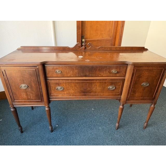 Elevate your dining space with this exceptionally elegant 1930s Federal Revival sideboard buffet. Masterfully constructed...
