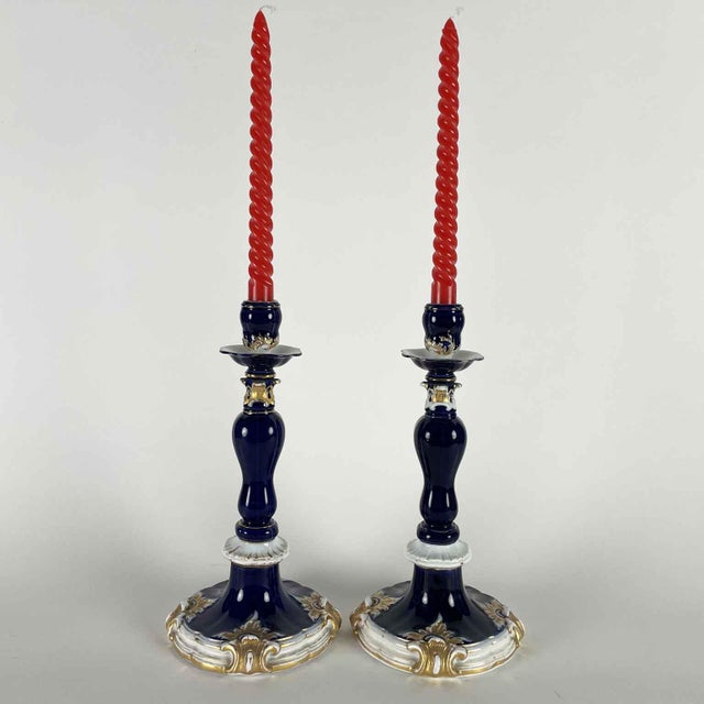 A pair of 19th-century Meissen Blue and Gold porcelain candlesticks dating back to the first half of the 19th century. The...