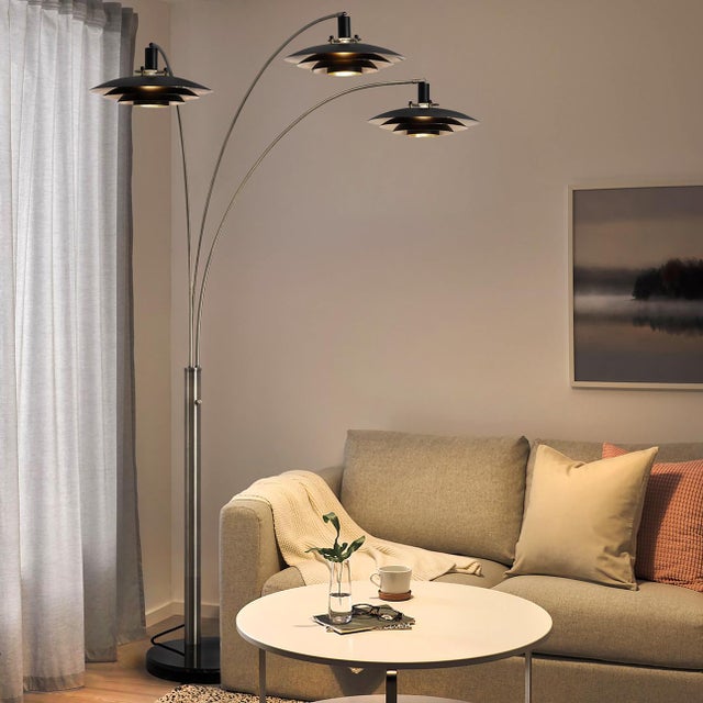 A Mid-Century Modern classic, the Rancho Mirage 3 Light Arc Floor Lamp is a captivating designer piece inspired by a...