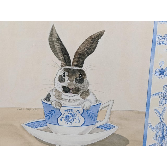 Late 20th Century Kari Phillips Teacup Bunny Series Framed Prints, White, Blue & Light Brown – Pair For Sale In New York - Image 6 of 13