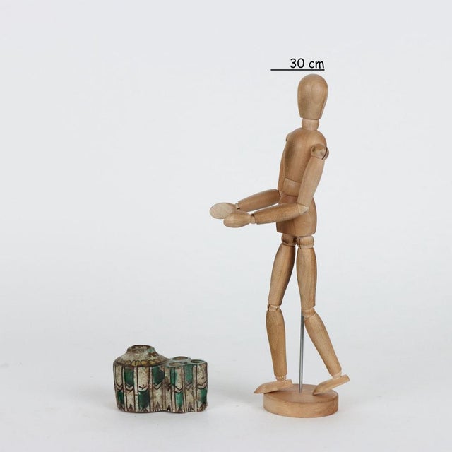 Inkwell in glazed earthenware, of Middle Eastern production with reservoir and three openings for inserting writing...