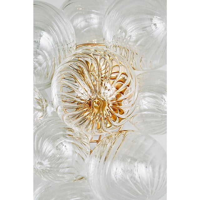 Description: Artisanal glass elevates the Talia series by Julie Neill, offering a new take on the simple glass globe light...