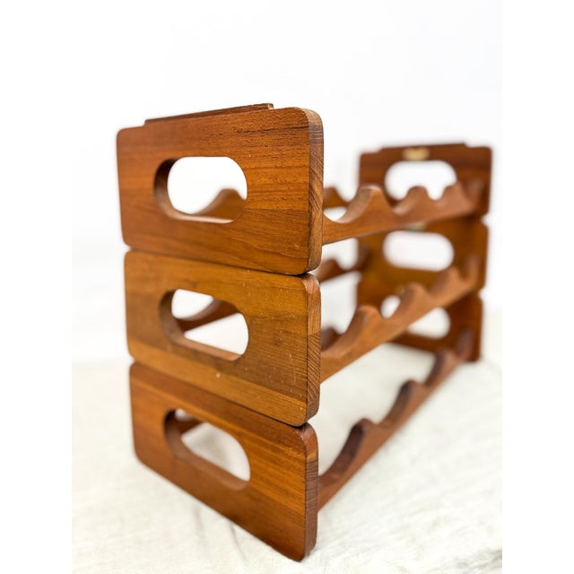 Showcase your wine collection in style with this vintage Selandia Designs teak modular wine rack. Crafted from warm,...