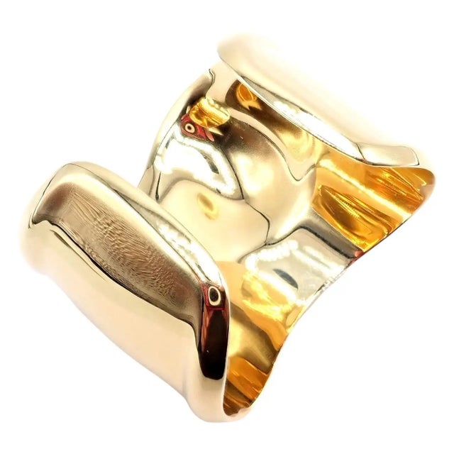 Tiffany & Co. Peretti Yellow Gold Medium Bone Cuff Bracelet Details: Metal: 18k Yellow Gold Length: For 6" Wrist Weight:...