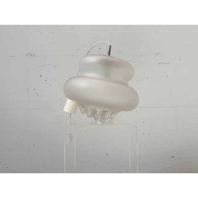 Iconic pendant lamp by peill & putzler from the 1970s. The ah 43 model is distinguished by its organically shaped, hand-...