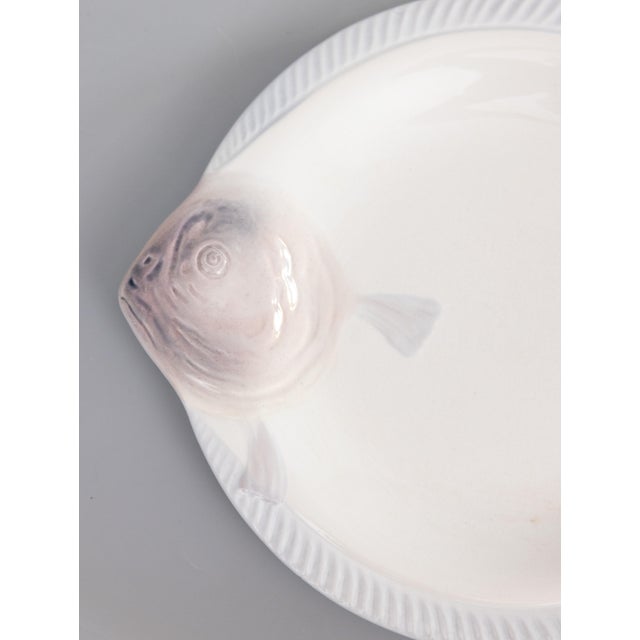 A stylish Art Deco French Longwy majolica fish plate, circa 1930. Maker's mark on reverse. It's a rare color, white with...