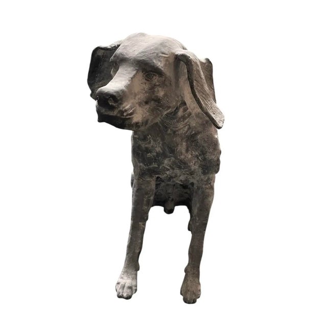 This striking life-size garden statue depicts a seated hound, captured in a moment of quiet alertness. Cast in heavy iron,...