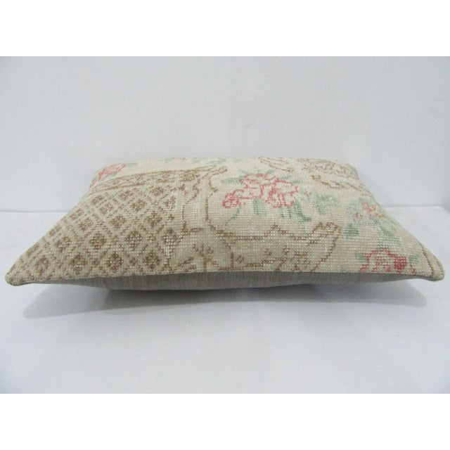 Decorative pillow cover made from a vintage Turkish handknotted rug. Backed with good quality cotton fabric. Pillow...