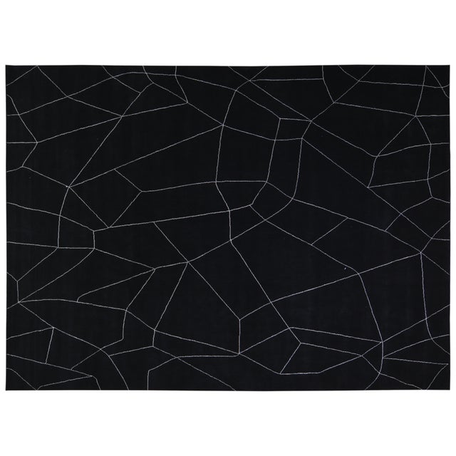 Hand-knotted with care using traditional rug-making techniques, this wool rug blends timeless craftsmanship with a modern...