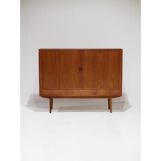 A rare highboard, model 54, designed by the renowned arne vodder for sibast in denmark during the 1960s. It was originally...