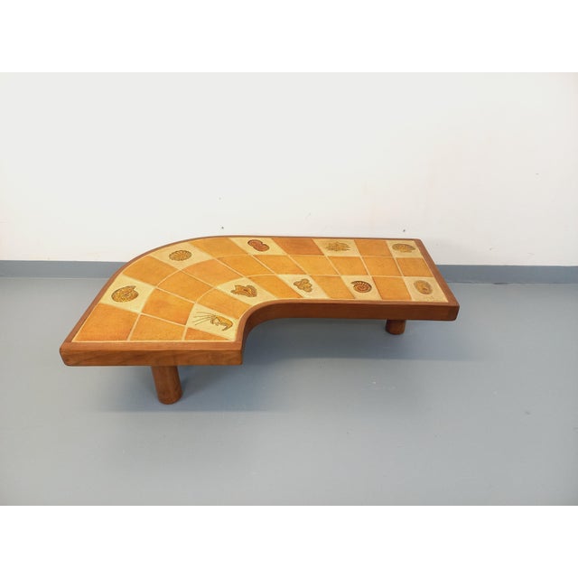 Large vintage Barrois comma-shaped coffee table from the 1960s/70s, with three round cylindrical legs and a wooden frame....