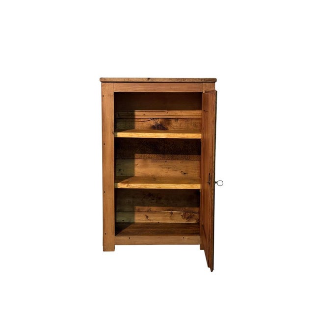 A simple and elegant cabinet dating back to the early 1900s, crafted from solid fir wood and featuring clean, functional...