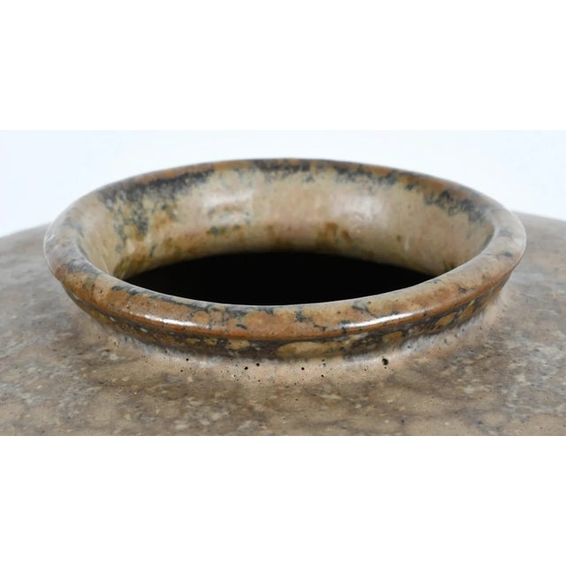 High-fire stoneware body with multiple-layered glazes by Hiroshi Nakayama. Thick construction and heavy.