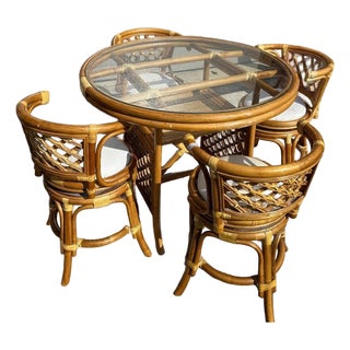 A Set of 5 Rattan Glass Top Table and 4 Swivel Chairs With White Cushions, 1970s For Sale