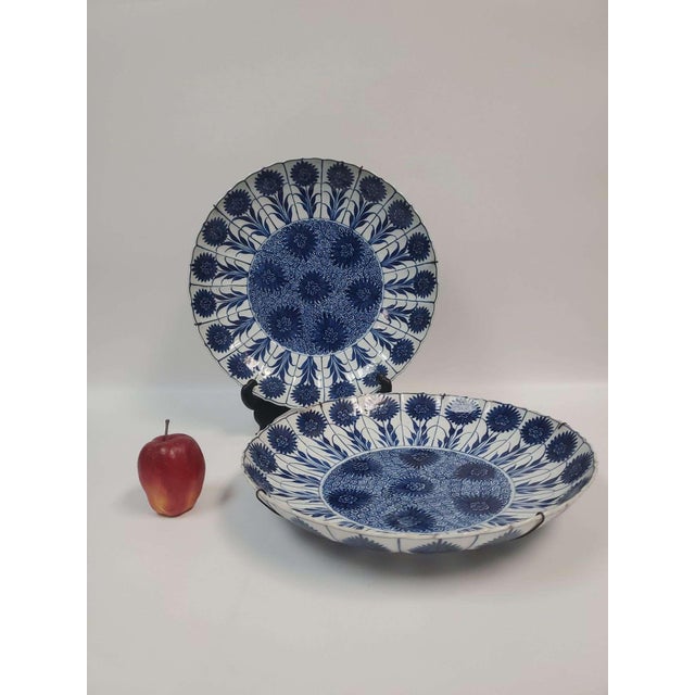 Two antique porcelain, blue and white, chargers; Possibly dated from the Ching Dynasty, 1662-1722, with carnation décor;...