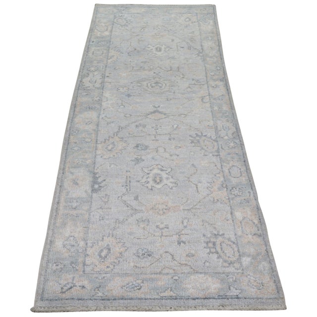 Hand-knotted with care using traditional rug making techniques, this wool rug blends timeless craftsmanship with a modern...