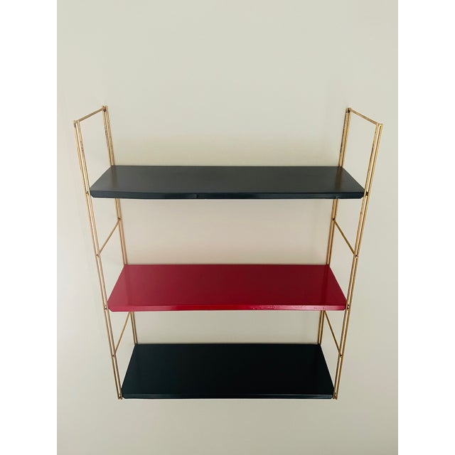 Vintage, mid-century, adjustable/ modular, brass and metal wall mount shelf, from the 1960's, in the style of "string"....