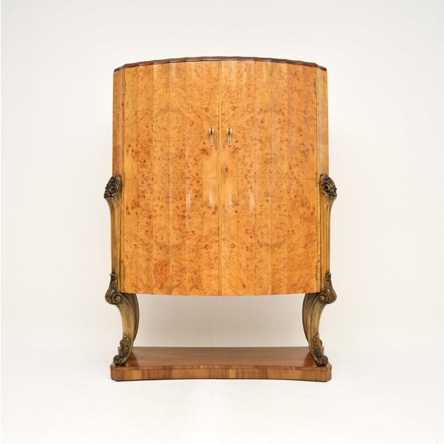 A magnificent Art Deco burr walnut cocktail cabinet by Epstein. This was made in England, it dates from the 1920’s. It is...