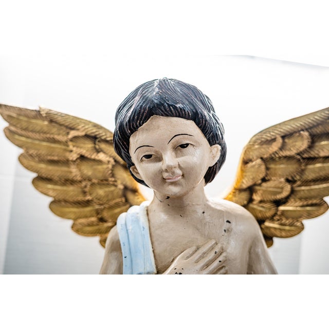 Charming and beautiful this vintage statue is in soft and gentle tones and quite sturdy.. He stands 30inches tall and with...