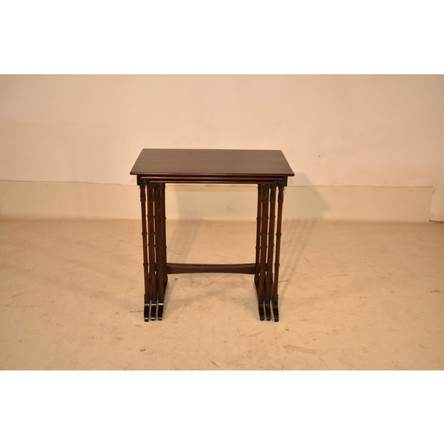 Period Edwardian set of three mahogany nesting tables from England, circa 1920. This lovely set consists of three...