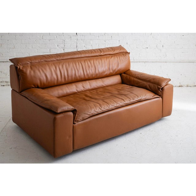 Mid-century Italian sofa in cognac leather by Carlo Bartoli for Rossi di Albizzate. Matching modular sofa and armchairs...
