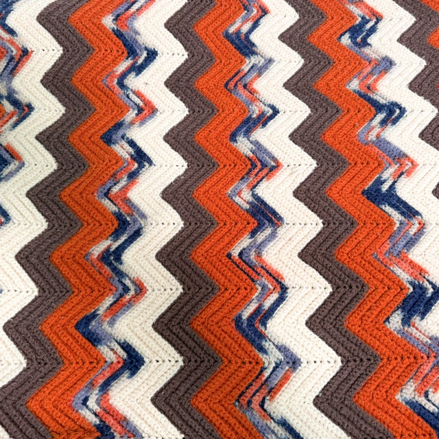 Striking vintage handmade crochet blanket in a classic 1970s ripple chevron pattern, worked in a beautifully warm and...