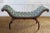 Antique French hand carved wooden bench with high sides and curved legs. Soft green Damask tufted upholstery.