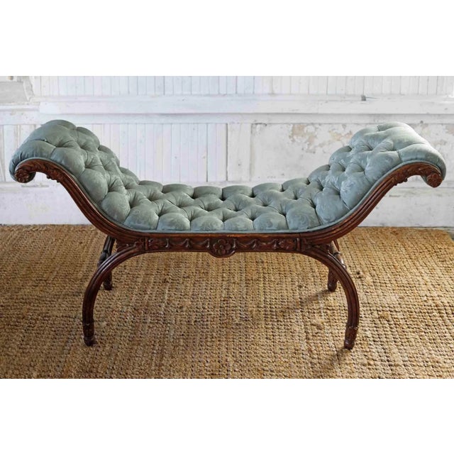 Antique French hand carved wooden bench with high sides and curved legs. Soft green Damask tufted upholstery.