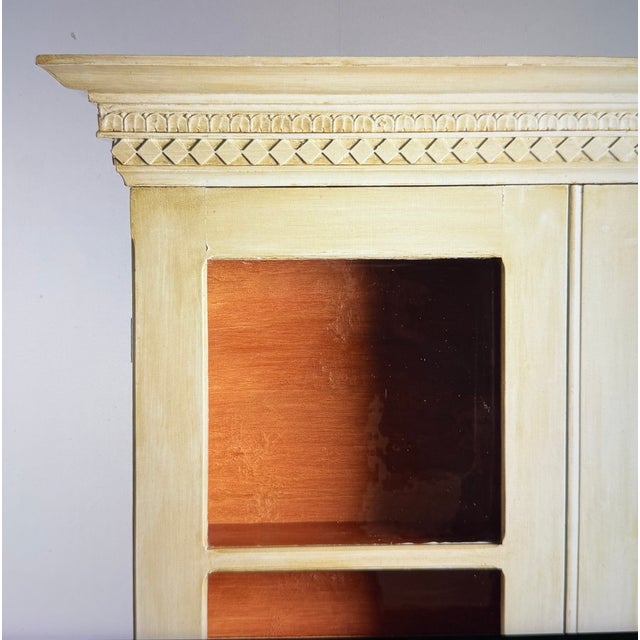 A beautiful 19th-century display cabinet. It features wonderful Gustavian details such as tapered and fluted legs, a shell...