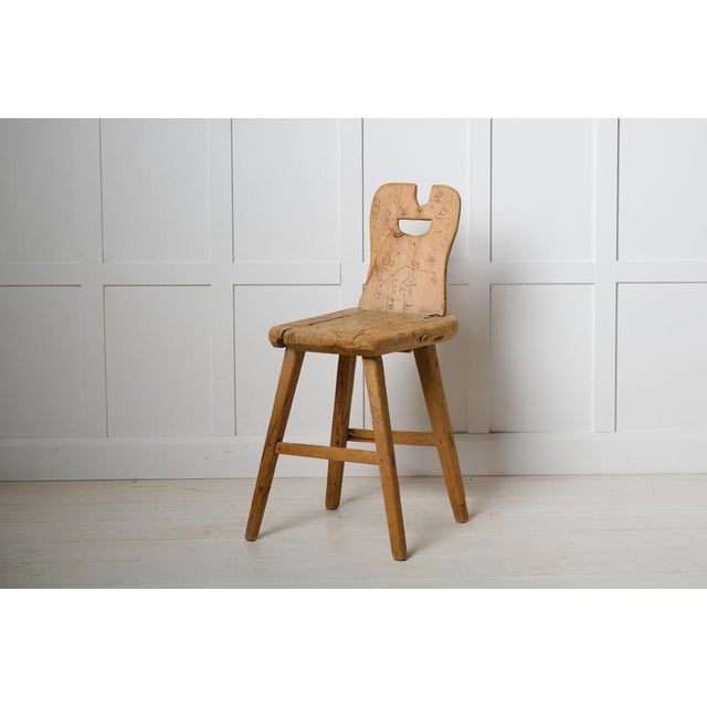 Unusual Swedish folk art chair. Primitive and made by hand in solid pine, around the mid 1800s in northern Sweden. The...