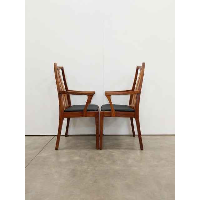 Pair of authentic vintage mid century modern teak armchairs / dining chairs. By Nathan. Maker's label on bottoms. This set...