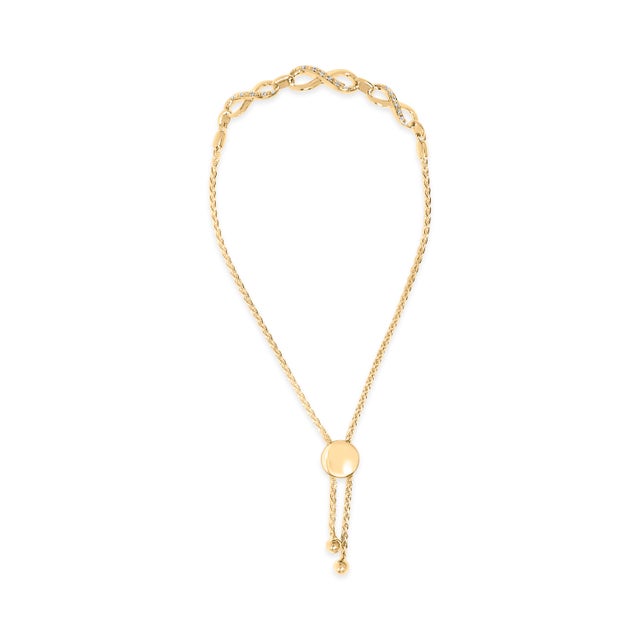 A graceful ode to forever, this lariat bolo bracelet traces the wrist with a row of open infinity links, each symbol...