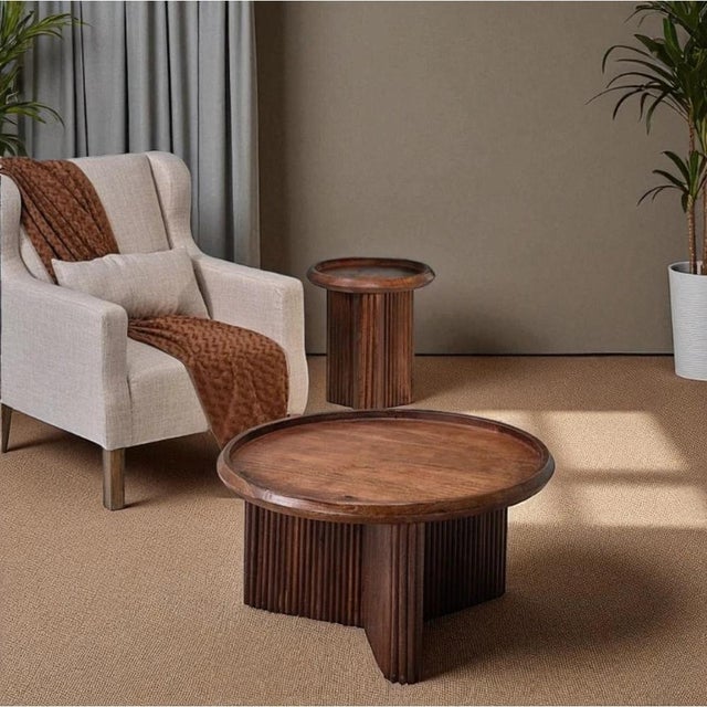 A round side table in warm brown wood offers a practical accent for seating areas, entryways, and bedrooms -- its compact...