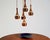 Copper and glass pendant lamp, composed of five pendant shades. Attributed to Staff, Germany, 1960s. Composed of five...