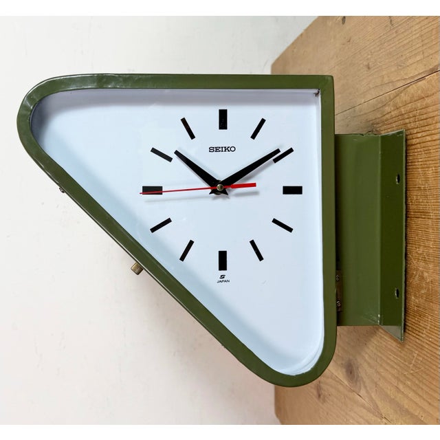 Vintage Industrial triangle maritime wall clock made by SEIKO in Japan during the 1970s. These clocks were used on large...